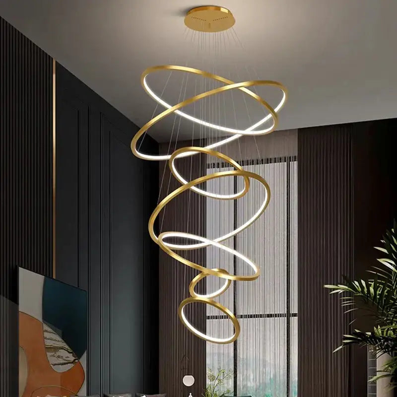 Gold-toned nordic home decorbites spiral ring chandelier with interlocking rings and led lighting for home decor stair use