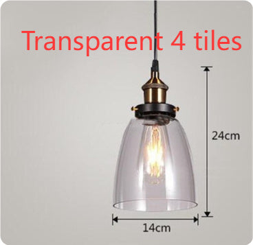 Transparent glass pendant light with brass accents and a black metal frame.