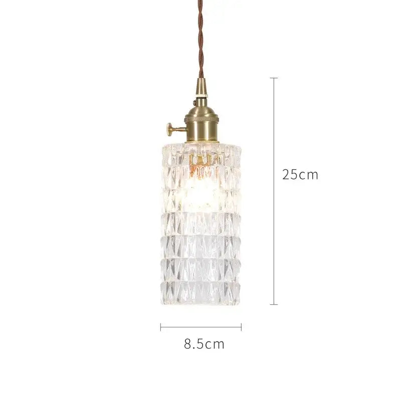 Clear faceted glass pendant lights with brass socket and brown cord in nordic japan style for dining room use