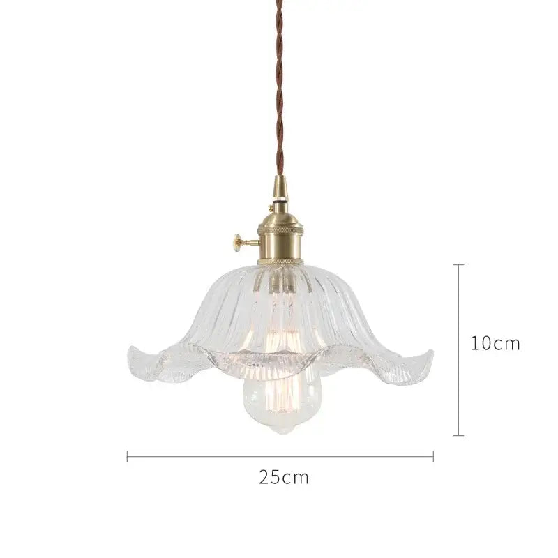 Clear glass pendant light with fluted petal design and brass hardware for nordic japan style dining room lighting
