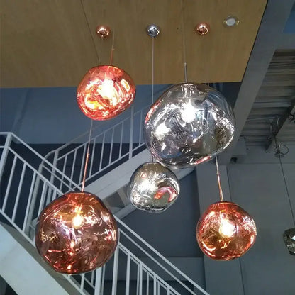 Nordic lava glass chandelier with spherical pendant lights in copper and silver finishes for dining room decorbites nordic lava