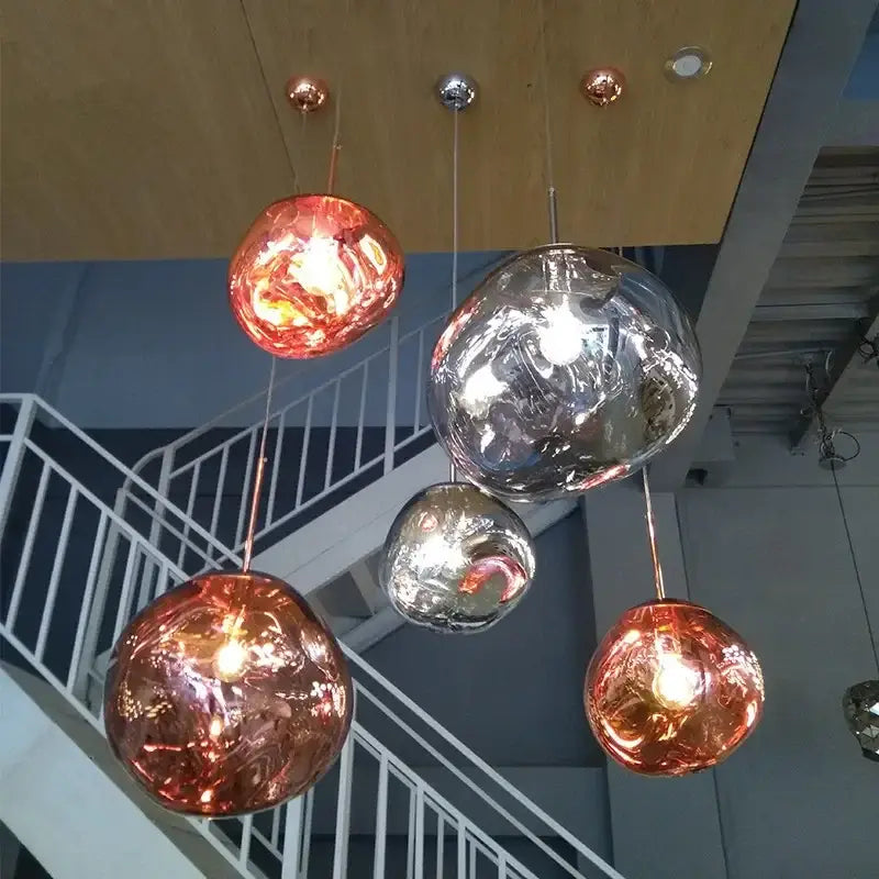 Nordic lava glass chandelier with spherical pendant lights in copper and silver finishes for dining room decorbites nordic lava