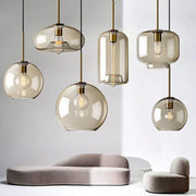 Set of modern nordic led glass pendant lights with smoked glass and brass accents for dining room lighting