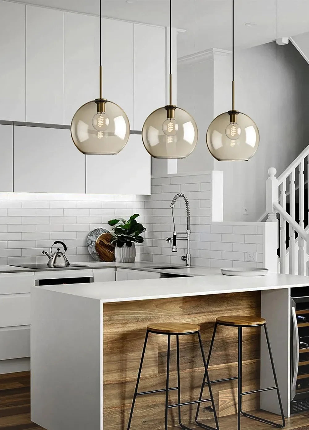 Three modern pendant lights with smoked glass globes and brass accents for nordic led glass dining room decor