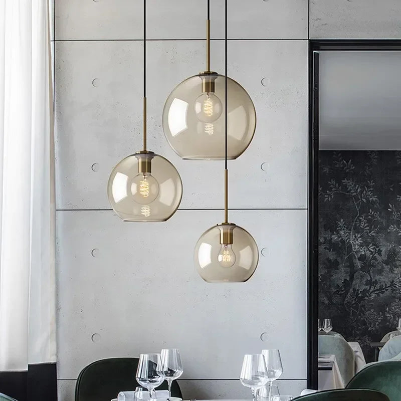 Set of three spherical amber glass pendant lights with brass accents and filament bulbs for dining room nordic led glass chandelier