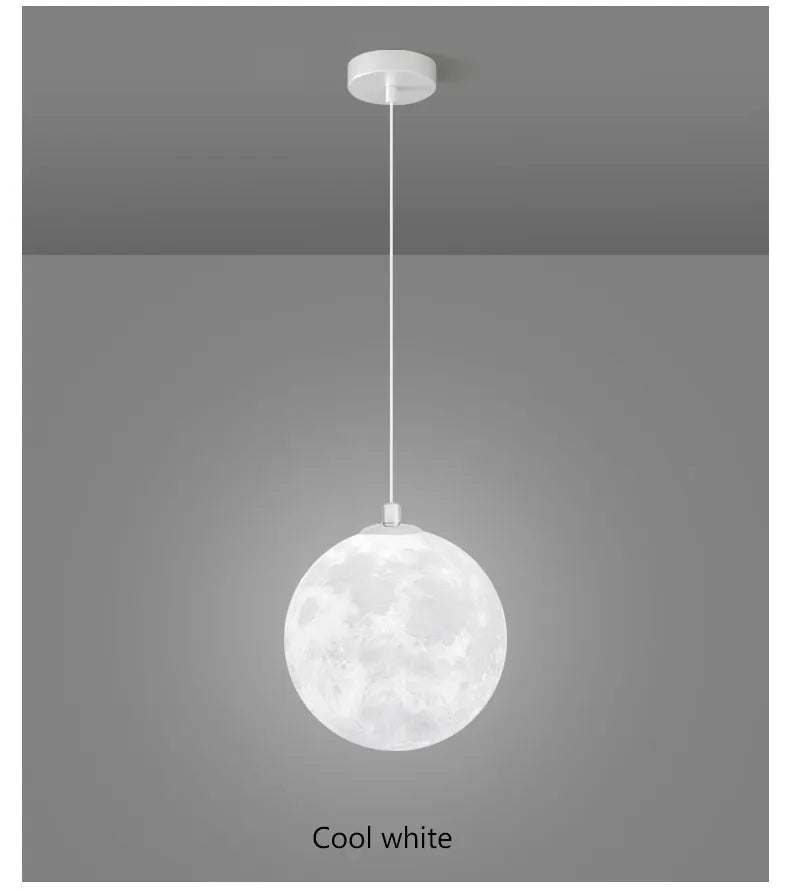 A spherical cool white nordic LED moon pendant light with textured crater surface for dining room kitchen decor