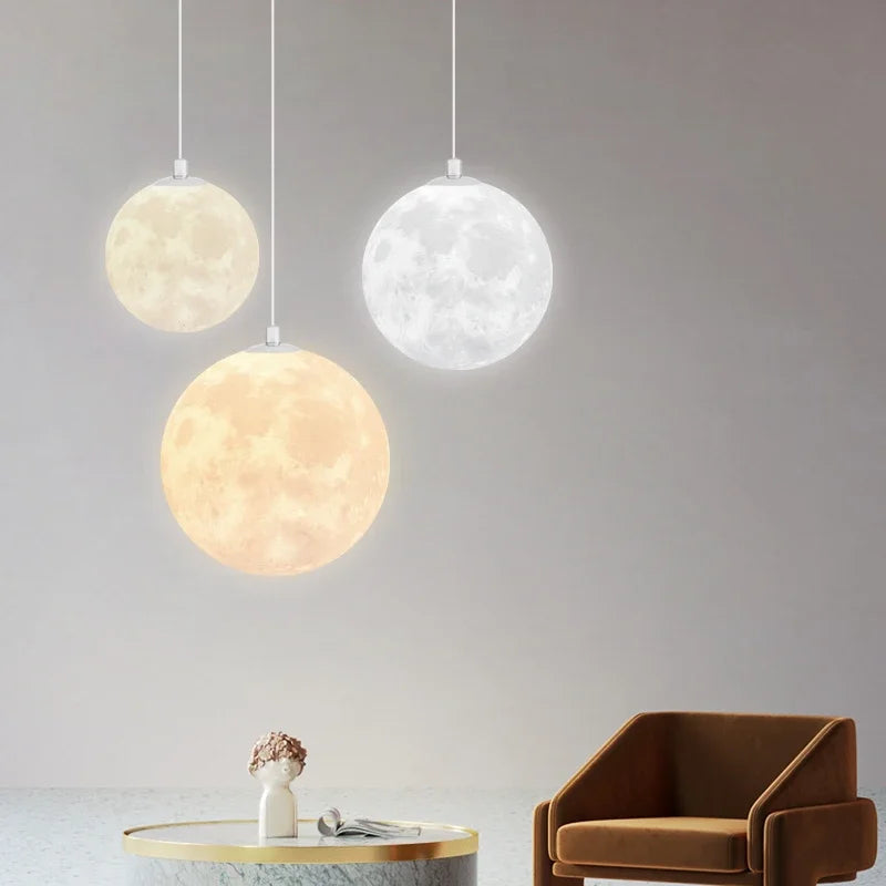 Nordic led moon pendant chandeliers with textured crater surface emitting warm and cool light for dining room kitchen decor