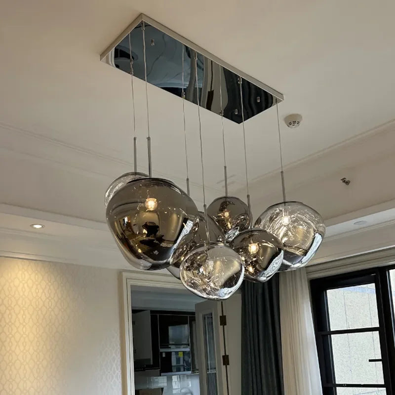 Modern chrome-finished spherical nordic led pvc pendant lights hanging from a rectangular mirrored ceiling fixture