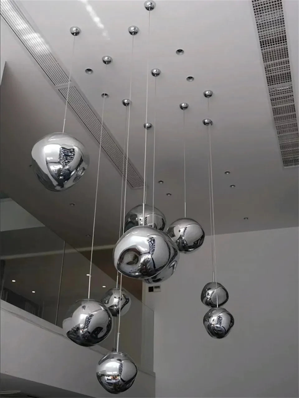 A modern nordic led pvc pendant light with polished chrome spheres for bedroom living and dining room lighting