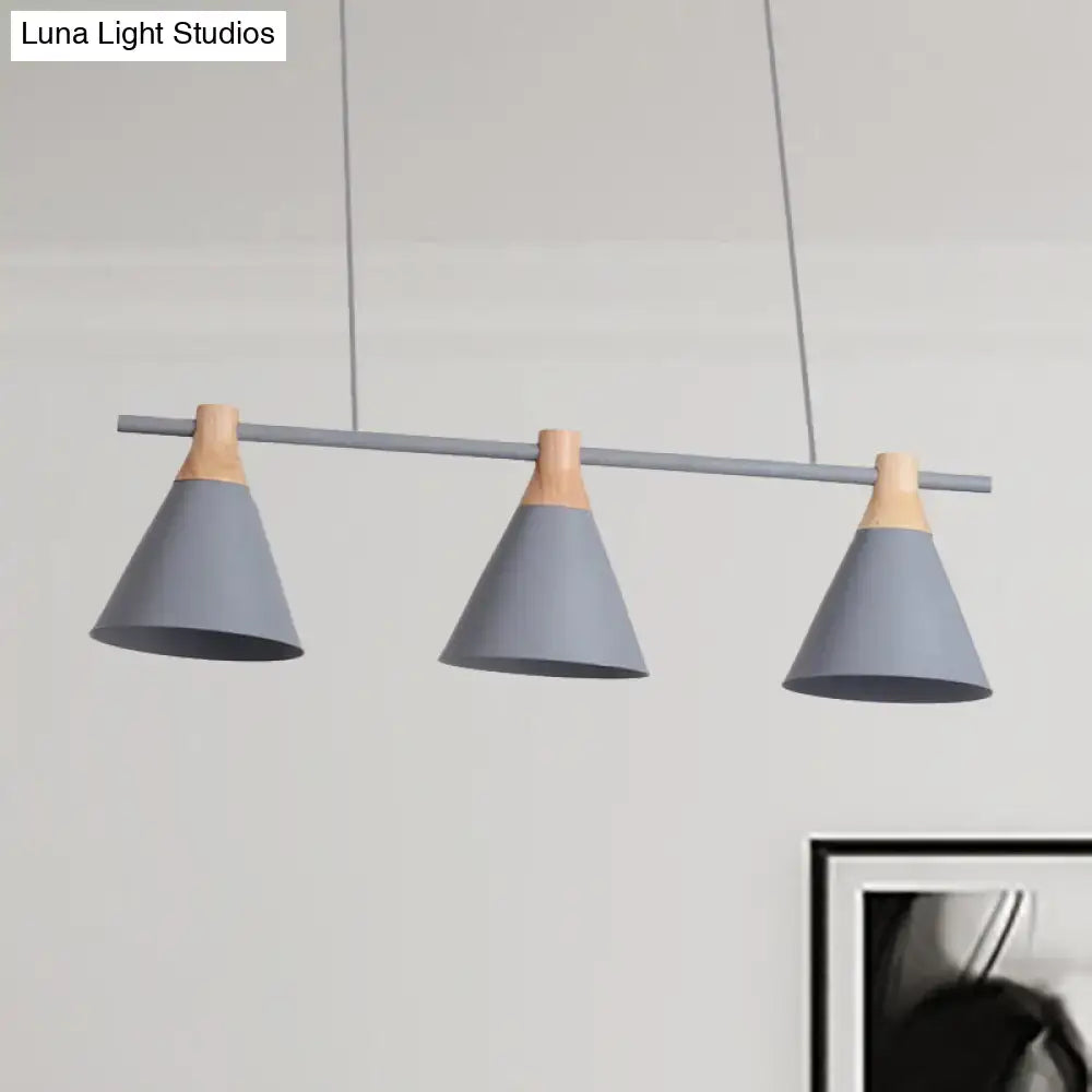 Modern gray and green nordic metal pendant light with wooden accents and triple cone shades for kitchen island lighting