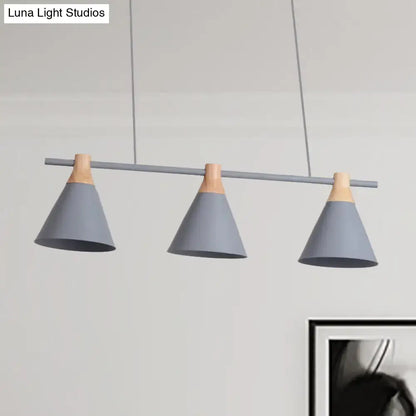 Modern gray and green nordic metal pendant light with wooden accents and triple cone shades for kitchen island lighting
