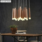 Modern wooden pendant lamp with warm glowing led base and vertical natural wood slats nordic minimalist wood art