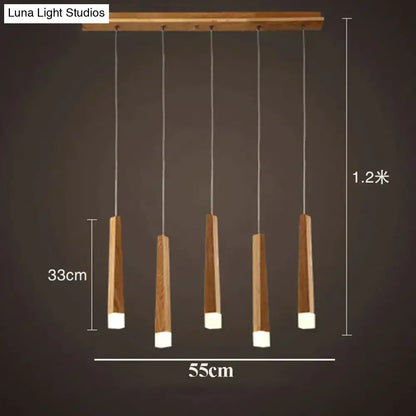 Modern nordic minimalist wood pendant lamp with five tapered wood rods and white acrylic ends for dining room