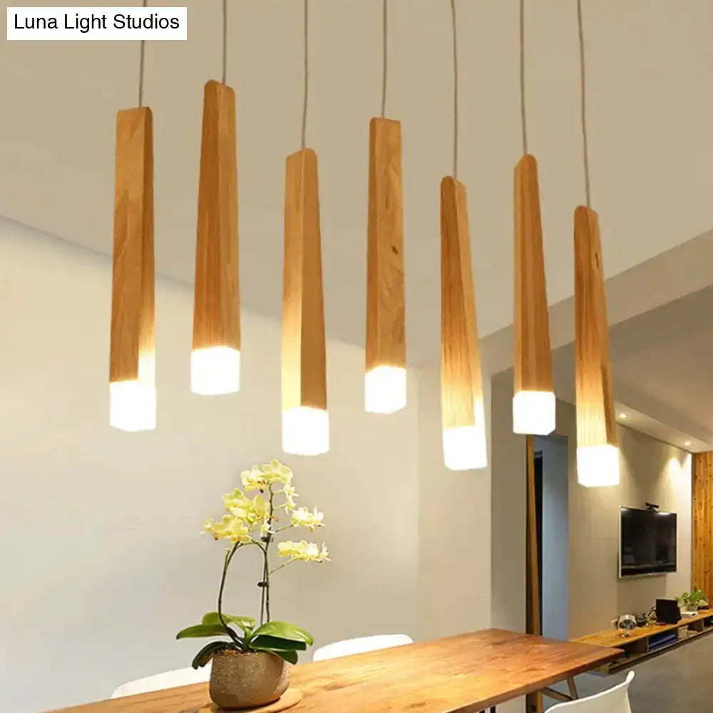 Six light-brown nordic minimalist wood pendant lamps with warm white illuminated bases for dining room lighting
