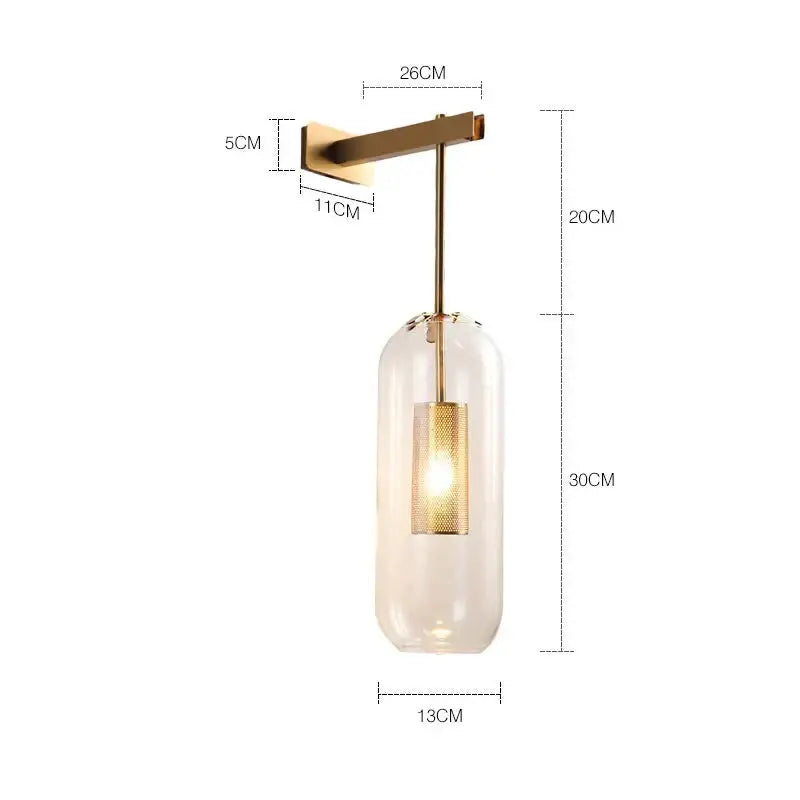 Nordic modern decor brass wall lamp with a clear glass lampshade and gold mesh diffuser for bedroom use