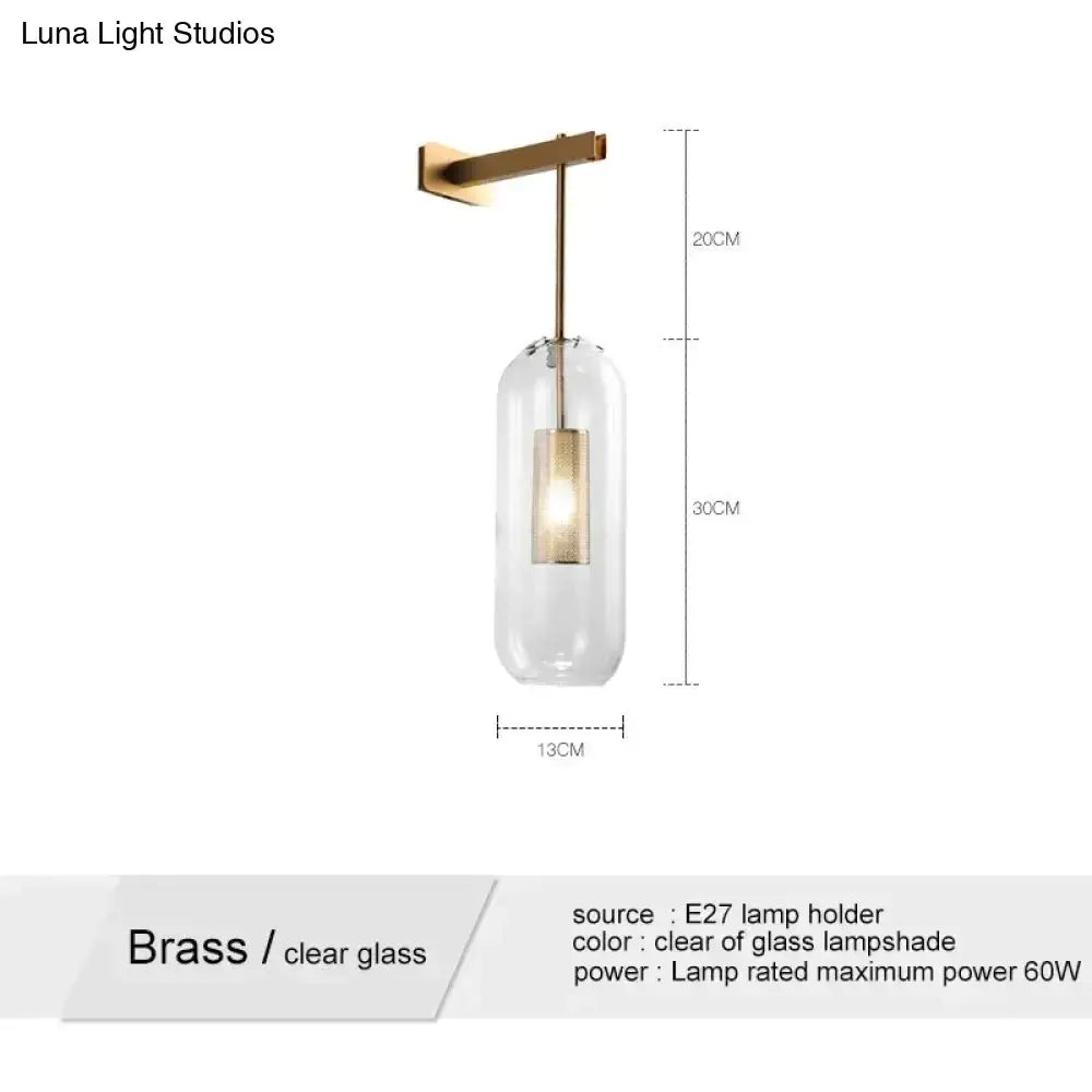 A brass pendant wall lamp with a clear glass lampshade and e27 bulb holder for nordic modern decor bedroom