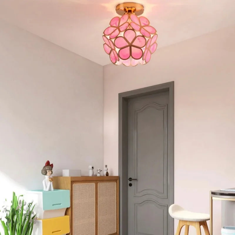 Pink floral petal acrylic pendant lamp with gold-toned metal frame for bedroom bedside and restaurant lighting