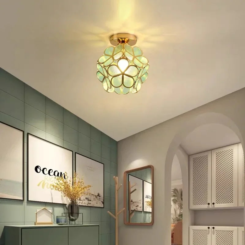 Nordic modern petal acrylic pendant lamp with gold-toned spherical stained glass floral design for bedroom and foyer lighting