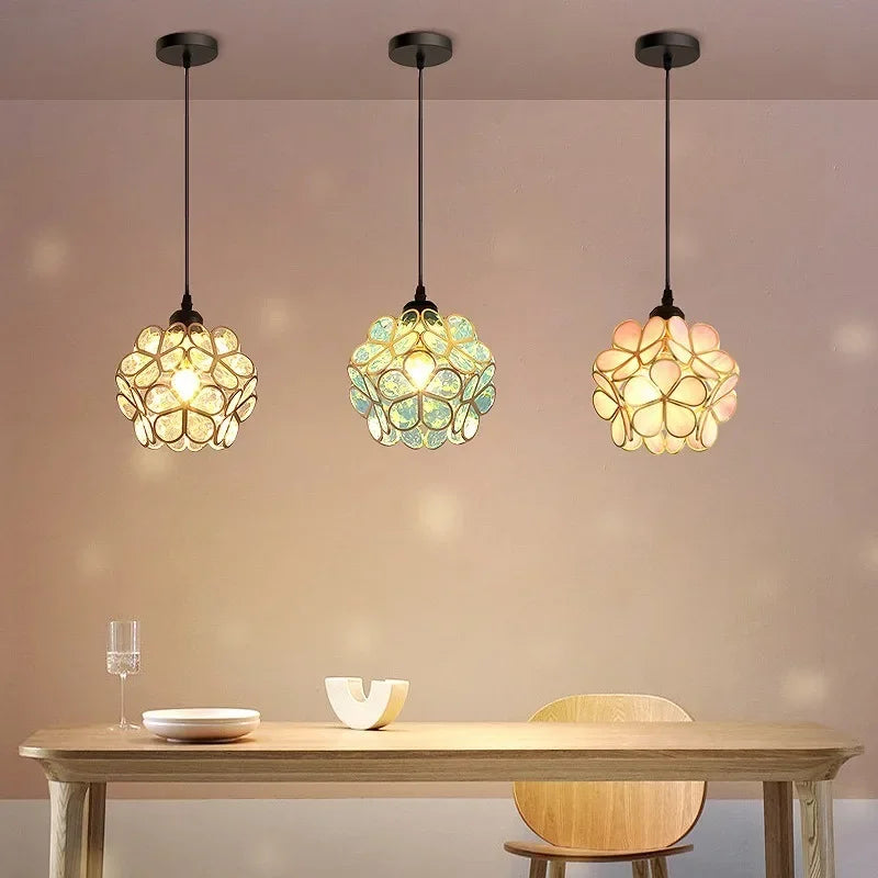 Three nordic modern pendant lamps with pastel spherical flower-like acrylic shades for bedroom and restaurant lighting