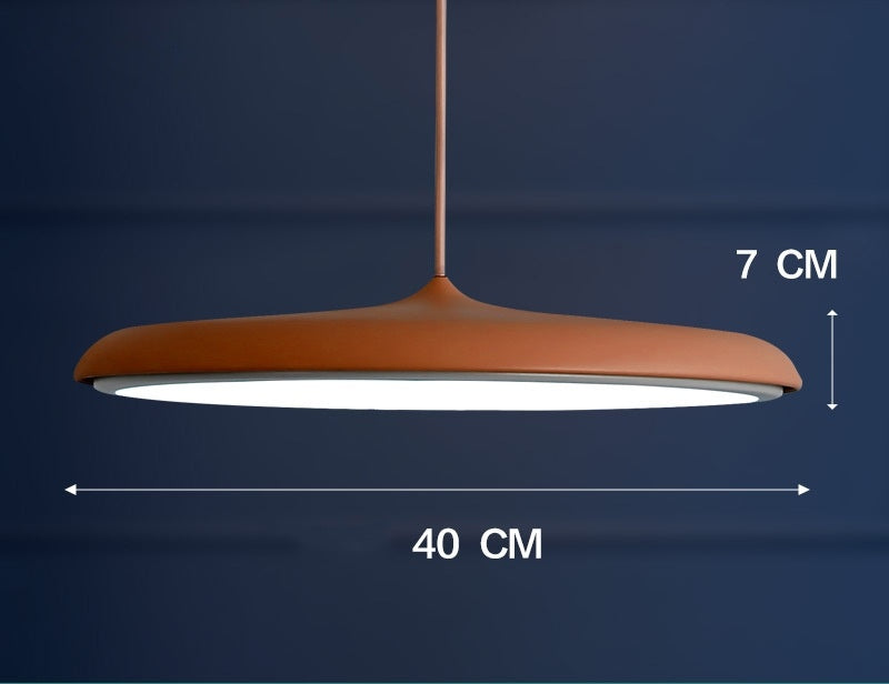 Copper-colored pendant light with a matte finish and modern design.