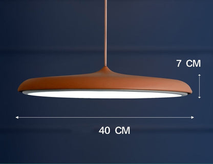Copper-colored pendant light with a matte finish and modern design.