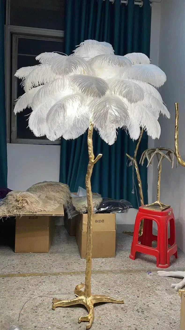 White ostrich feather floor lamp with gold metallic tree-like stand for living room and bedroom decor lighting