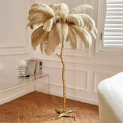 Nordic feather floor lamp with golden metallic trunk and cream plume crown for living room or bedroom decor lighting