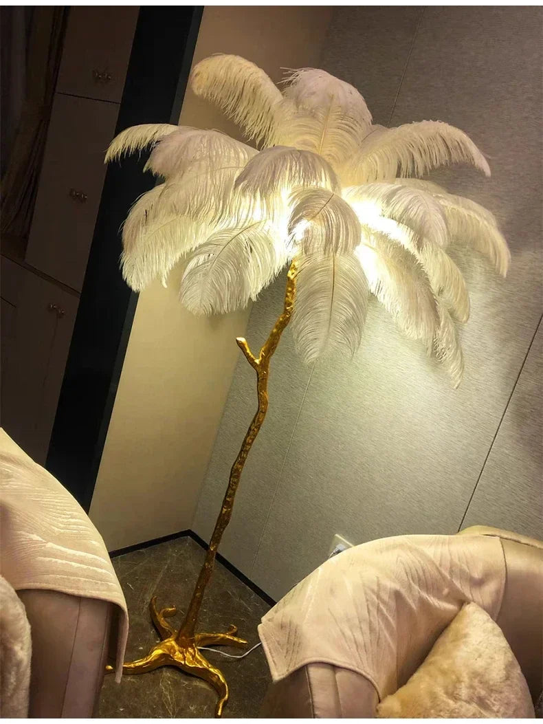 Luxurious floor lamp with golden branch base and white ostrich feathers ideal for living room and bedroom decor