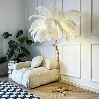 White feather floor lamp with gold-toned branch-like base for living room and bedroom decor lighting