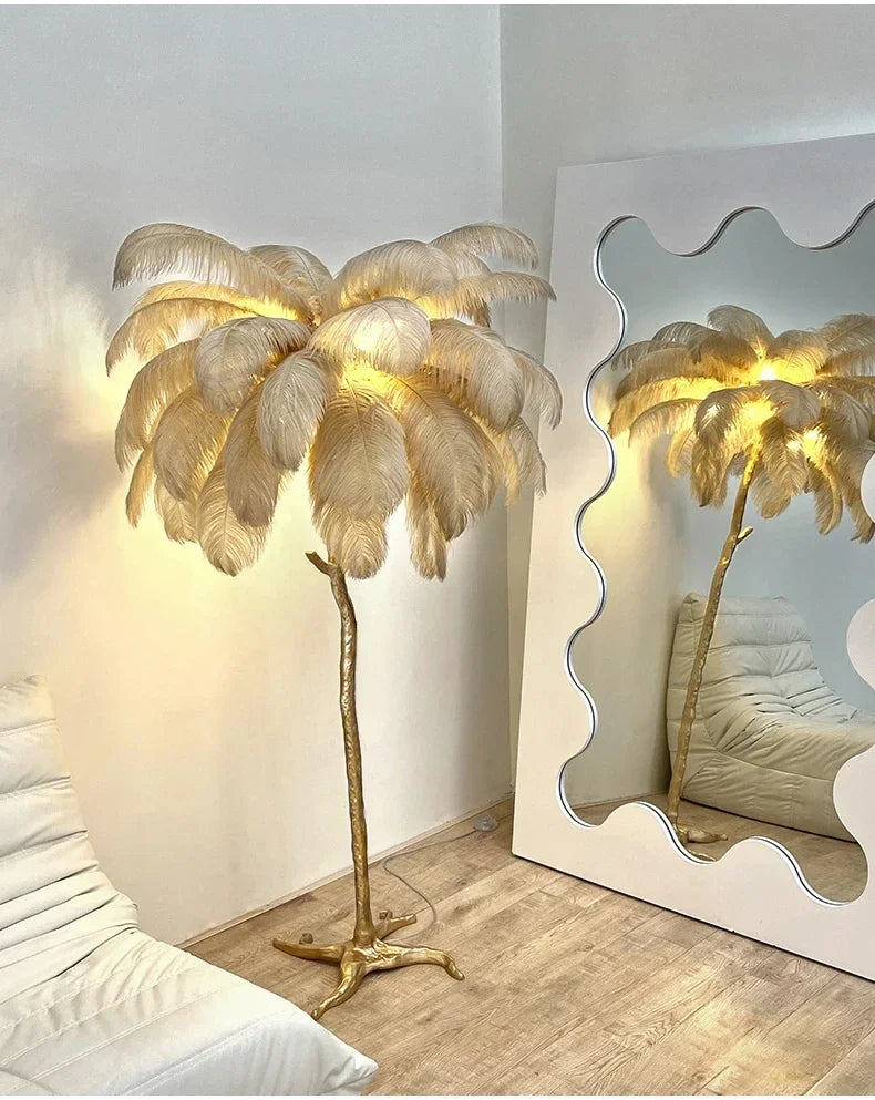 Golden feather floor lamp with slender trunk and illuminated plumes ideal for living room and bedside lighting