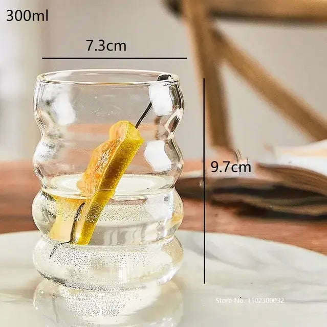 Clear glass cocktail cup with playful segmented design and small handle from decorbites glass cocktail cups set