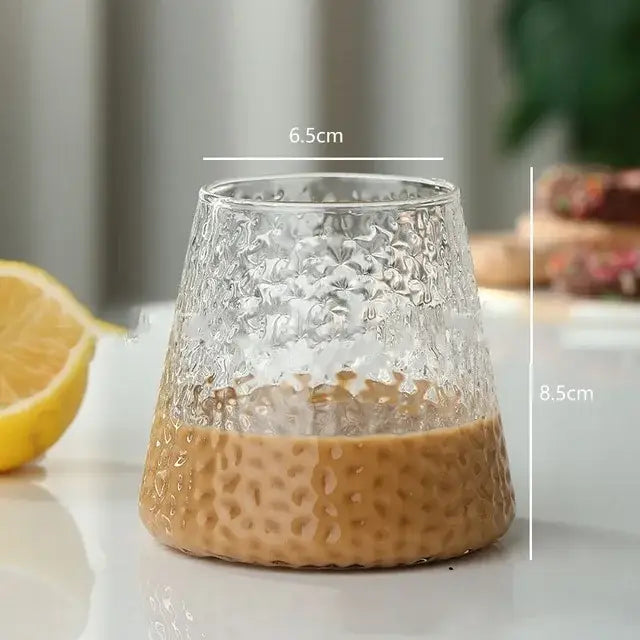 Clear textured glass cocktail cup with hammered pattern and frosted base filled with coffee from decorbites glass cocktail set