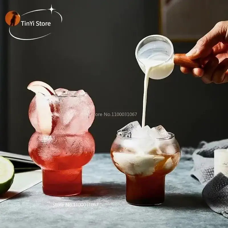 Clear glass tumblers with bulbous shape and thick bases in a nordic pink glass cocktail cups set decorbites glass cocktail