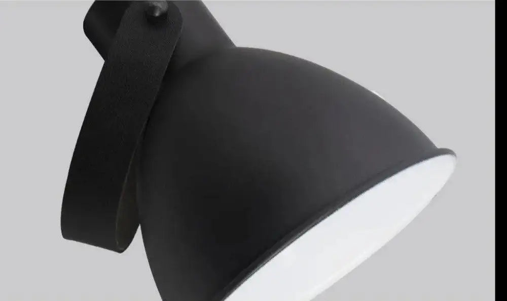 Nordic plug-in wall sconce in black finish with black matte industrial desk lamp and leather strap handle