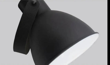 Nordic plug-in wall sconce in black finish with black matte industrial desk lamp and leather strap handle