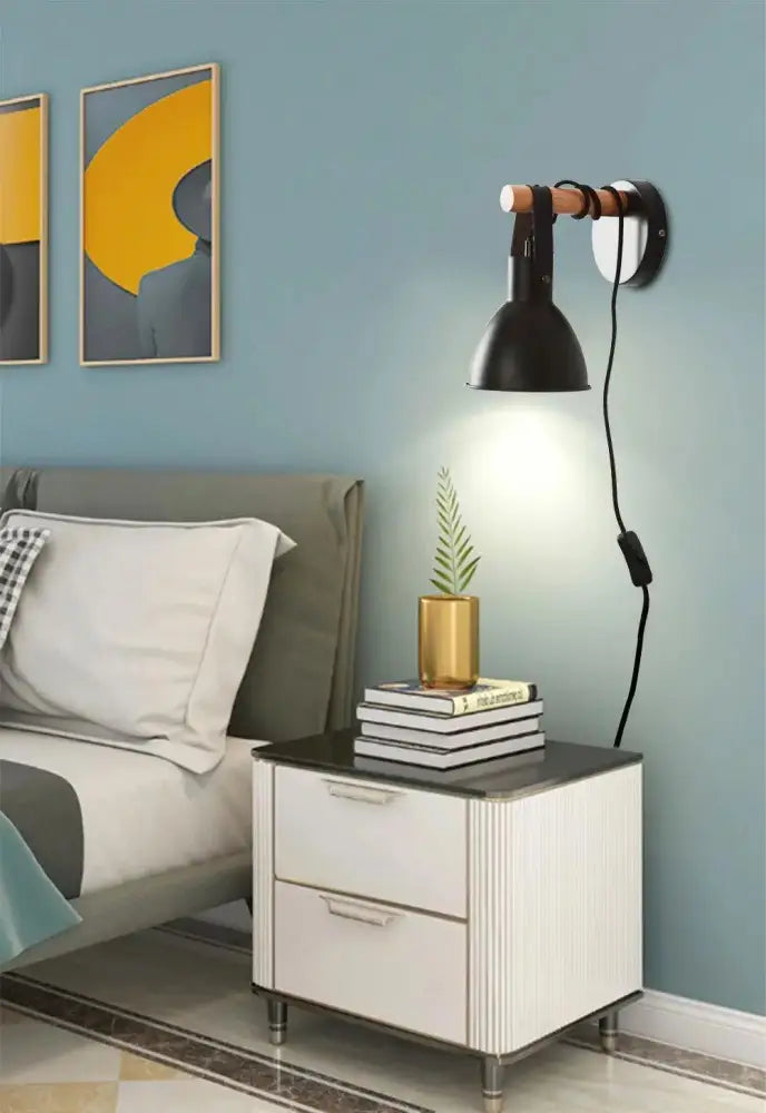 Black finish nordic plug-in wall sconce with wooden handle and adjustable arm featuring algunda plug design