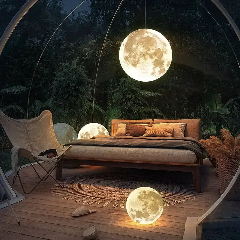 Glowing moon chandelier pendant light with nordic retro ball design and realistic cratered surface emitting warm light