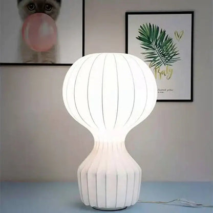 Nordic white silk table lamp with ribbed balloon upper section and fluted base ideal for bedroom decor