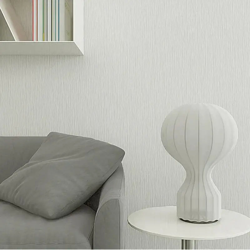 White ribbed ceramic table lamp with sleek modern design featuring silk shade for bedroom decor and gatto silk table use
