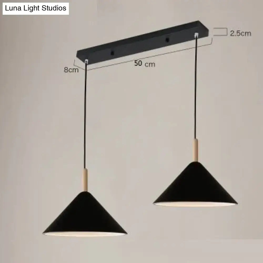 Black matte conical nordic simple kitchen pendant light with wooden accents hanging from black rectangular bar