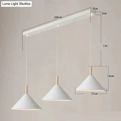 Minimalist nordic simple kitchen pendant light with white conical shades and wooden accents on a matte black ceiling bar