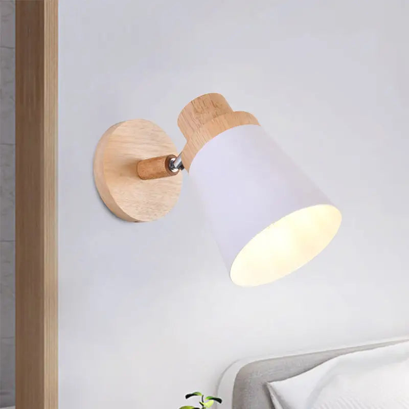 Nordic style wall light with natural wood base and matte white coolie shade for baby room ideal lighting