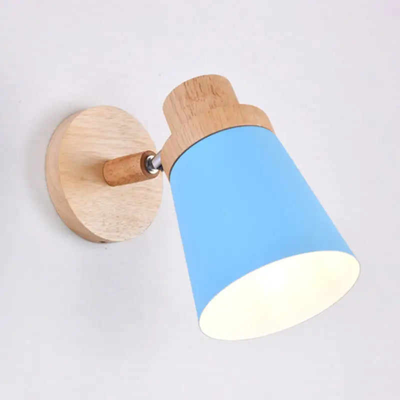 Nordic style gray and wood wall light with blue coolie shade and natural wood accents for baby room inch fixture