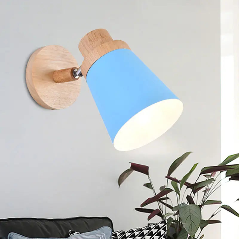 Blue conical nordic style wall light with coolie shade, natural wood base, and metal joint for baby room lighting