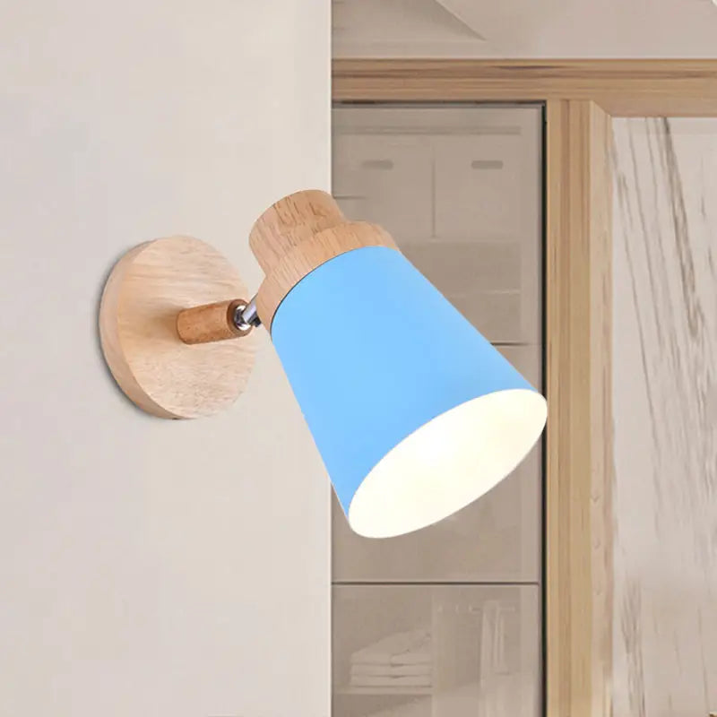 Nordic style blue conical wall light with coolie shade, natural wood base, and adjustable arm for baby room