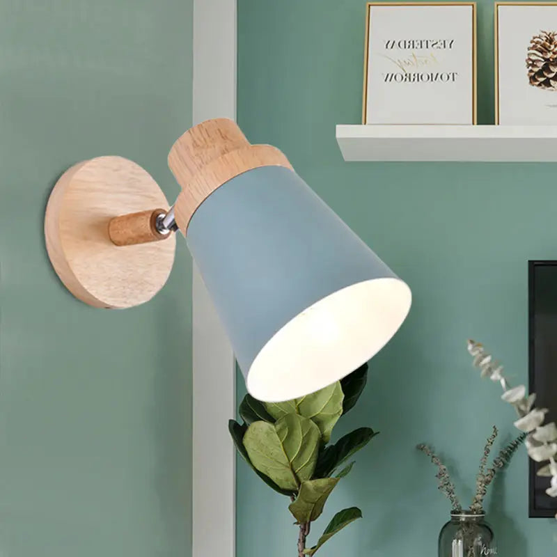 Nordic style wall light with blue matte coolie shade and natural wood base for baby room lighting