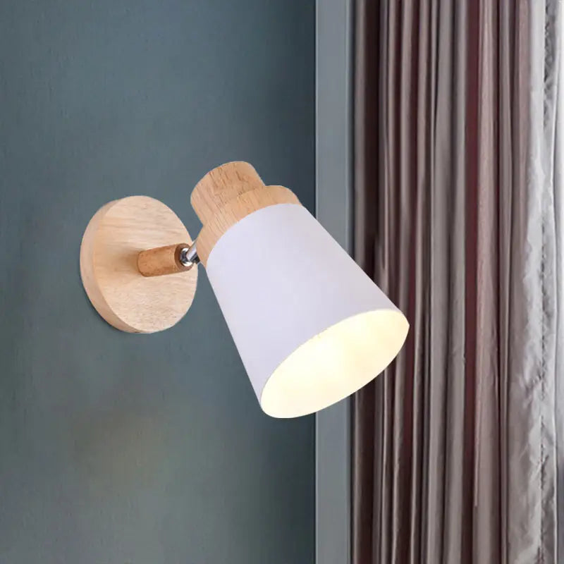 Minimalist nordic style wall light with natural wood base and matte white coolie shade for baby room