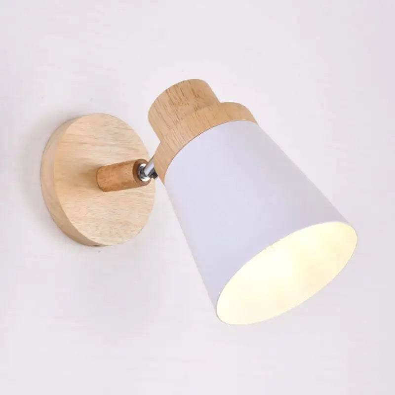 Nordic style wall light with natural wood base, matte white coolie shade, and adjustable arm for baby room lighting