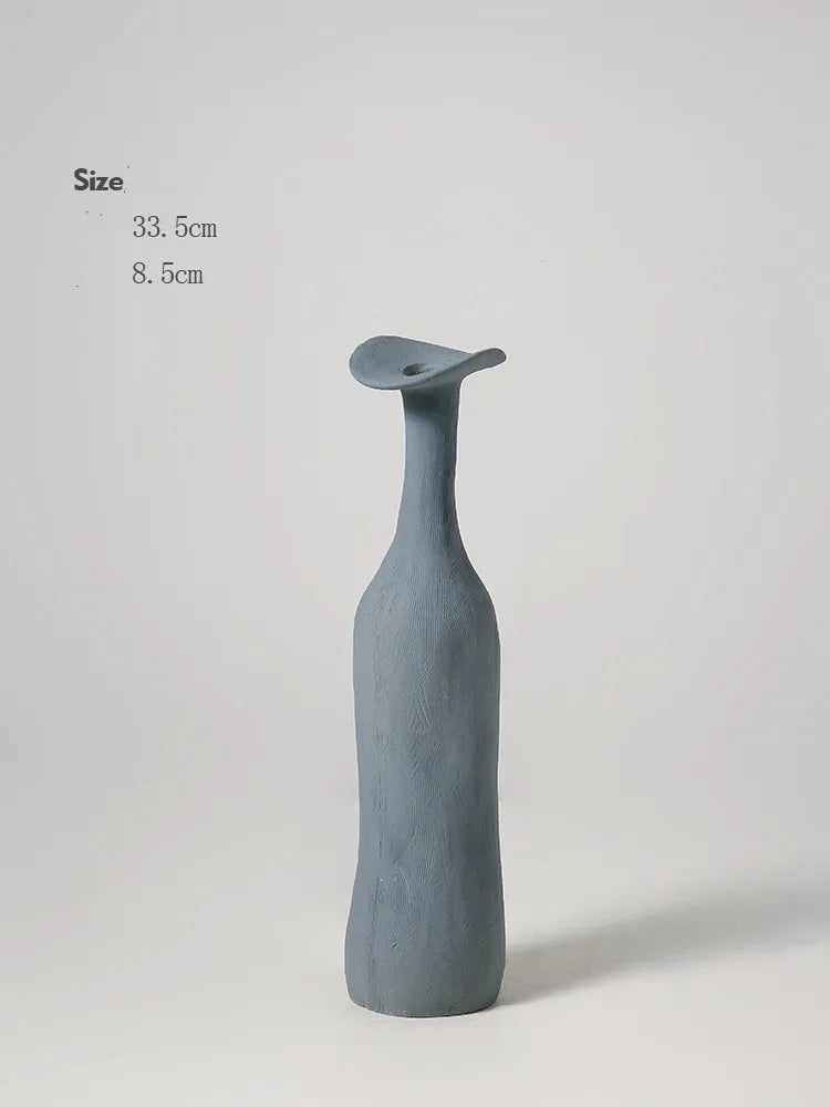 A sleek matte gray ceramic vase with a slender neck and flared top for nordic style modern home decoration