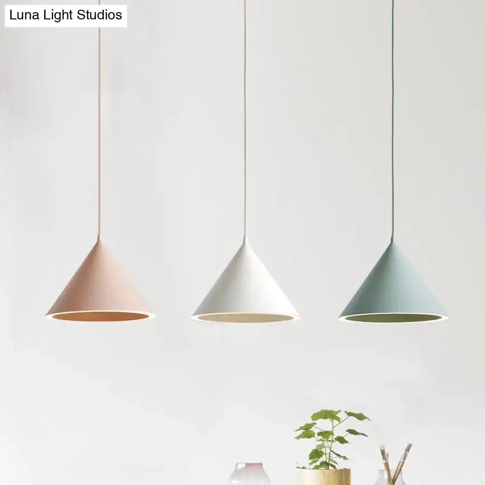 Three minimalist cone-shaped decorbites™ ceramic pendant lights in pastel pink white and mint green nordic stylish hanging lamp